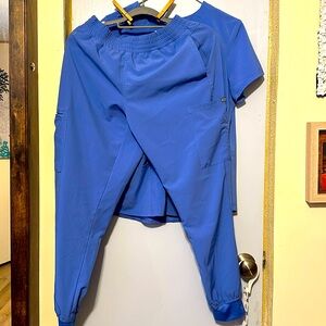Med couture scrubs light blue. Size medium. No flaws